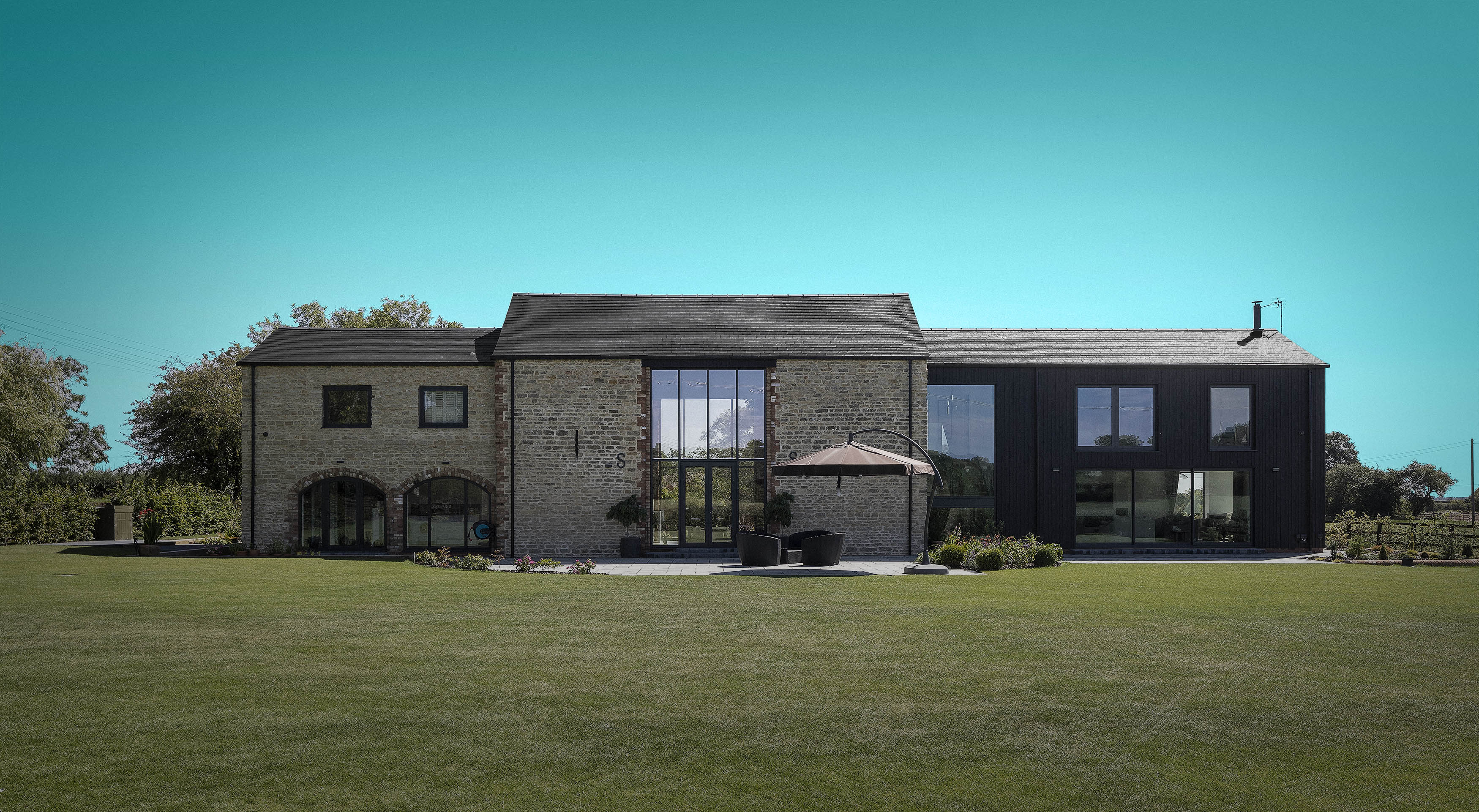 A photo of a farm house featuring an XO Solar Roof.